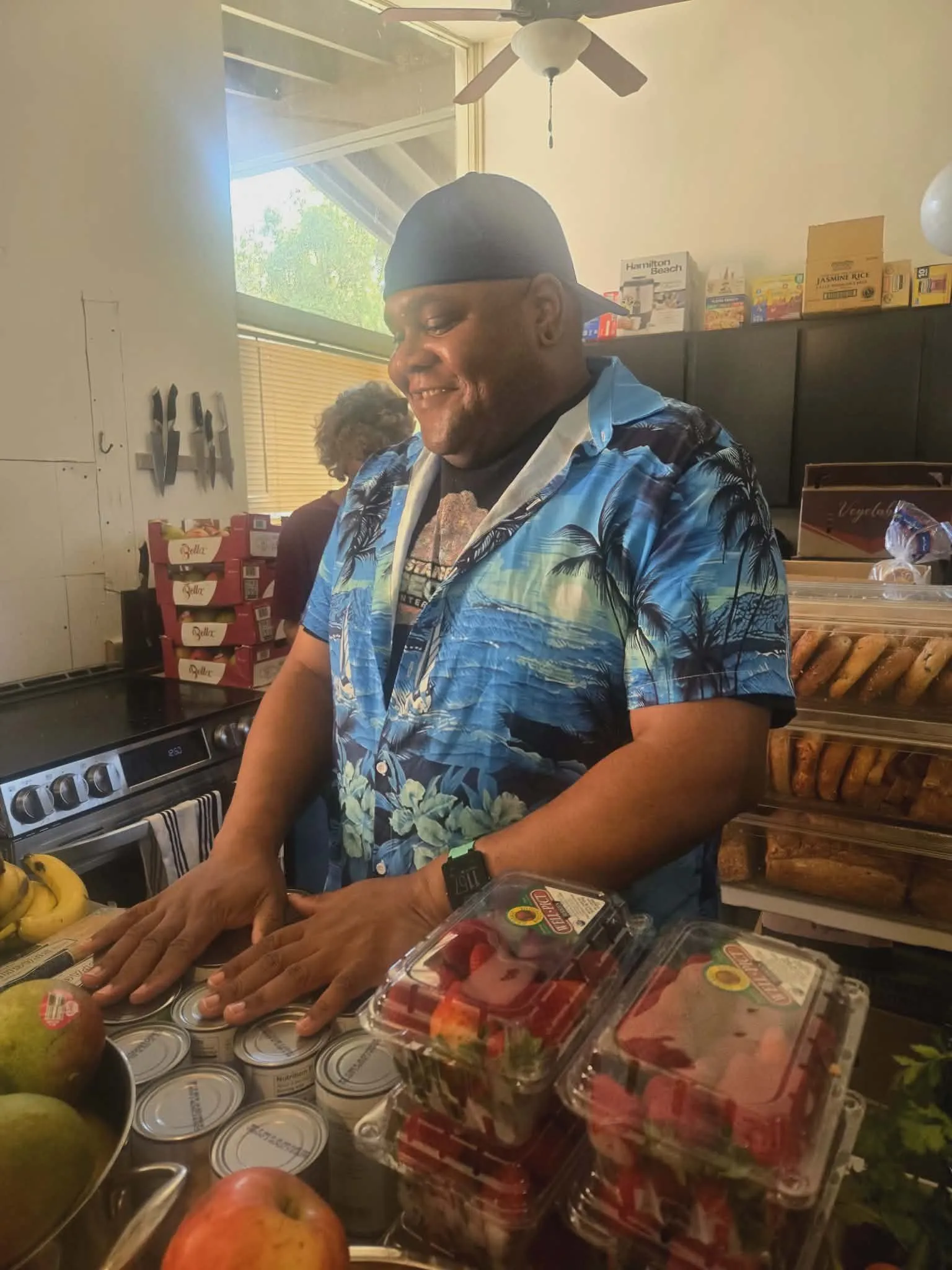A volunteer organizing food for a CityHeART gathering