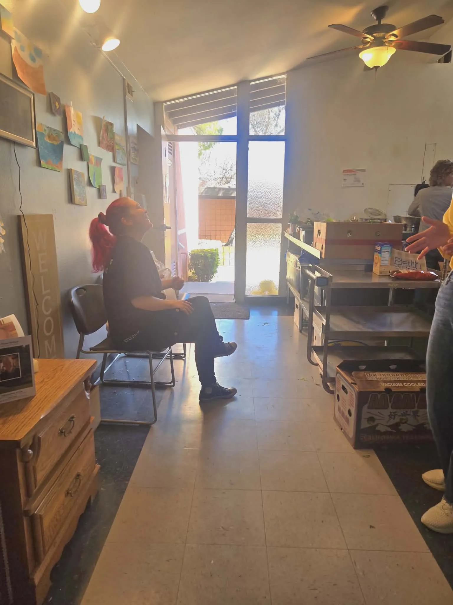 A welcoming CityHeART area where volunteers prepare food boxes for neighbors
